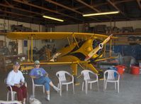 N133JU @ SZP - 1936 Bucker Jungmeister 133C, Siemens-Halske SH 14-A4 radial 160 Hp, in Krybus host hangar, Bucker Fly-In - by Doug Robertson