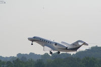 N577JC @ PDK - Departing 20R - Note Helicopter in distance! - by Michael Martin