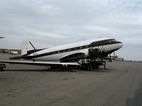 N115SA @ CNO - First Flight Inc. Douglas DC-3C with wings unbolted @ Chino Municipal Airport, CA - by Steve Nation