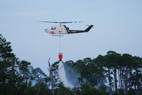N131FC - AH-1F Cobra on firefighting run near Eastpoint, FL - by John B. Spohrer