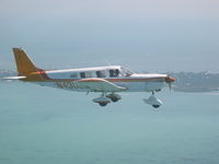 N4300F - Piper Cherokee Six flying over the upper Keys. - by George Carrazana