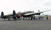 C-GVRA @ RDG - The people admiring this, one of only two flying Lancasters in the world, lend scale and perpective to this mighty bird. - by Daniel L. Berek