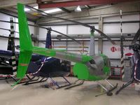G-JKAY @ EGTB - Robinson R44 hangared at Booker - by Simon Palmer
