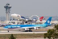 JA8920 @ LAX - Japan Airlines JA8920 (FLT JAL69) departing RWY 25R enroute to Kansai Int'l (RJBB) - Osaka, Japan, while Air Tahiti Nui F-OSEA (FLT THT21) rolls out from landing on RWY 25L after arrival from Charles De Gaulle (LFPG) - Paris, France. - by Dean Heald