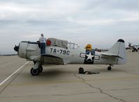 N6979C @ MER - Putting the cover on AT-6D 42-85408 (ain't no sun!) @ Castle AFB, CA - by Steve Nation