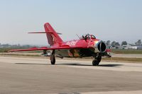 N117BR @ CMA - Bill Reesman in his 1959 Poland LIM-5 N117BR Red Bull waving to the crowd while taxiing back after his performance at the 2006 EAA Camarillo Air Show.