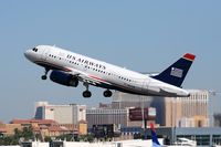 N801AW @ LAS - America West (US Airways) N801AW (FLT AWE262) departing RWY 25R enroute to Phoenix Sky Harbor Int'l (KPHX). - by Dean Heald