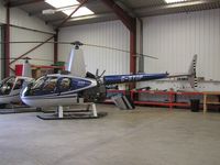 G-STOP @ EGBW - Robinson R44 in hangar at Wellesbourne - by Simon Palmer