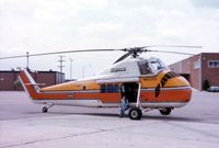 N62254 @ CMH - ex USMC UH-34D BuNo. 148079. This was when it was a Winnebago Heli-Home model, with my wife sitting in the door.  We watched it fly and toured it. - by Glenn E. Chatfield