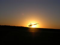 N86243 @ KM01 - Awesome picture of N86243 in sunset - by Melinda Sue Williams