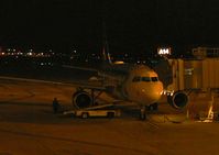 N918FR @ PHL - A Frontier A319 waits in the predawn darkness for its return trip to Denver. This aircraft features the whitetail deer on its tail. Beautiful aircraft! - by Daniel L. Berek