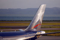 CC-CQC @ AKL - LAN's A340-300 tail, reflecting in the warm evening sun - by Micha Lueck
