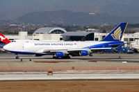 9V-SFH @ LAX - Singapore Airlines Cargo 9V-SFH (FLT SQC7966), still in hybrid colors, rolling out after arrival on RWY 25R from Ted Stevens Anchorage Int'l (PANC).