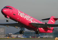 HB-JVE @ EGCC - Helvetic Pink Fokker - by Kevin Murphy