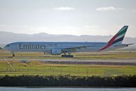 A6-EMX @ AKL - Turning onto the runway for take off - by Micha Lueck