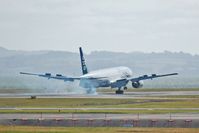 ZK-OKE @ AKL - Burning rubber at touch-down in Auckland - by Micha Lueck