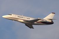 N265QS @ LAX - NetJets Aviation Dassult Falcon 2000 climbing out from RWY 25R late in the afternoon.
