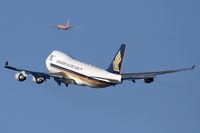 9V-SFM @ LAX - Singapore Airlines Cargo 9V-SFM (FLT SQC7883) climbing out from RWY 25R enroute to Brussels Nat'l (EBBR), while SWA1482 climbs out from 24L enroute to San Jose Int'l (KSJC).