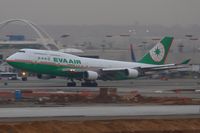 B-16412 @ LAX - EVA Air B-16412 (FLT EVA11) departing RWY 25R enroute to Chiang Kai Shek Int'l (RCTP) on a dreary January evening. - by Dean Heald