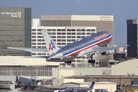 N323AA @ LAX - American Airlines N323AA (FLT AAL4) climbing out from RWY 7L enroute to John F Kennedy Int'l (KJFK). - by Dean Heald