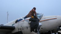 N93CA @ SZT - Sleeping bags are stuffed inside the cowling to keep the engine warm in cold weather - by Scott Dickenson
