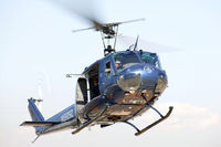 N5929Z - Bell UH-1H Huey Hovering - by Glenn Grossman