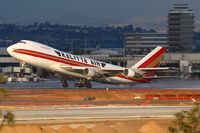 N701CK @ LAX - Kalitta Air N701CK departing a wet RWY 25R enroute to Incheon Int'l (RKSI), after a brief rain. - by Dean Heald