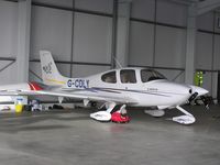 G-CDLY @ EGBT - Cirrus SR20 in the hangar at Turweston - by Simon Palmer
