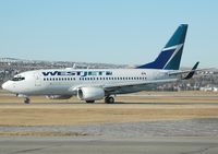 C-FKWS @ YYC - in line for 34 - by Bill Knight