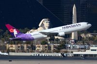 N593HA @ LAS - Hawaiian Airlines N593HA (FLT HAL7) climbing out from RWY 01R, in front of the Luxor Hotel & Casino, enroute to Honolulu Int'l (PHNL).
