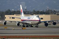 9M-MPH @ LAX - Malaysia Airlines 9M-MPH taxiing through the alley after arrival on the north complex. - by Dean Heald