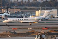 N63HS @ LAX - 2004 Gulfstream G-V(SP) G550 N63HS rolling out on RWY 25R after landing. - by Dean Heald