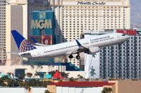 N17244 @ LAS - Continental Airlines N17244 (FLT COA396) climbing out from RWY 01R, passing in front of the Monte Carlo Hotel & Casino, enroute to George Bush Intercontinental Houston (KIAH). - by Dean Heald