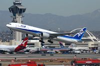 JA732A @ LAX - A classic view from the Imperial Hill of All Nippon Airways JA732A (FLT ANA5) departing RWY 25R enroute to Narita Int'l (RJAA). The tower and more significantly, the Theme building are well-known, defining landmarks of LAX. - by Dean Heald