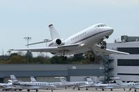 N296QS @ SMO - NetJets Aviation N296QS (2002 Dassault Falcon 2000) climbing out from RWY 3 enroute to San Francisco Int'l (KSFO).