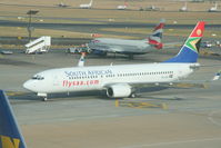 ZS-SJC @ FAJS - Johannesburg, South Africa, taken through terminal window - by Pete Hughes