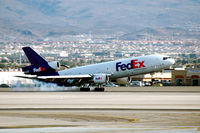 N377FE @ LAS - FEDEX jet touching down at McCarran - by John Little