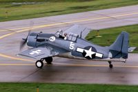 N6290C @ DPA - FM-2 86746 taxiing by the tower in the rain - by Glenn E. Chatfield