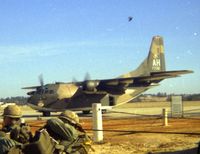 54-0700 @ POB - C-123K passing us troops waiting for loading into C-130 - by Glenn E. Chatfield