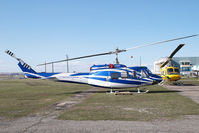 C-FBUC @ CYYC - Eagle Helicopters Bell 212 - by Yakfreak - VAP