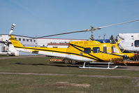 C-GEEC @ CYYC - Eagle Helicopters Bell 212 - by Yakfreak - VAP