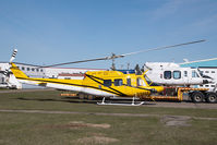 C-GEEC @ CYYC - Eagle Helicopters Bell 212 - by Yakfreak - VAP