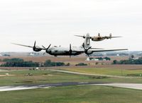 N529B @ CID - FIFI and Diamond Lil flying by the control tower - by Glenn E. Chatfield