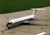 159119 @ CID - C-9B parking at the base of the control tower - by Glenn E. Chatfield