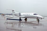 84-0087 @ ORD - C-21A during a rainy open house - by Glenn E. Chatfield