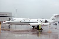 84-0087 @ ORD - C-21A during a rainy open house