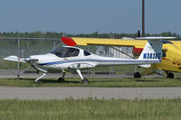 N383DC @ YXU - Parked by XU Aviation hangar. - by topgun3