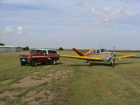 N9138S @ F82 - 1976 Bonanza Pictured with a 1980 International Scout - by Mark A. Drake