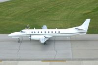 91-0513 @ CID - C-26B taxiing past the control tower. - by Glenn E. Chatfield