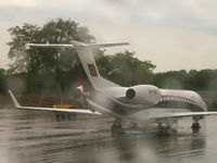 P4-IVM @ EDDT - Embraer ERJ-135 BJ/Taken through the aircraft window on a very wet day at Berlin-Tegel - by Ian Woodcock